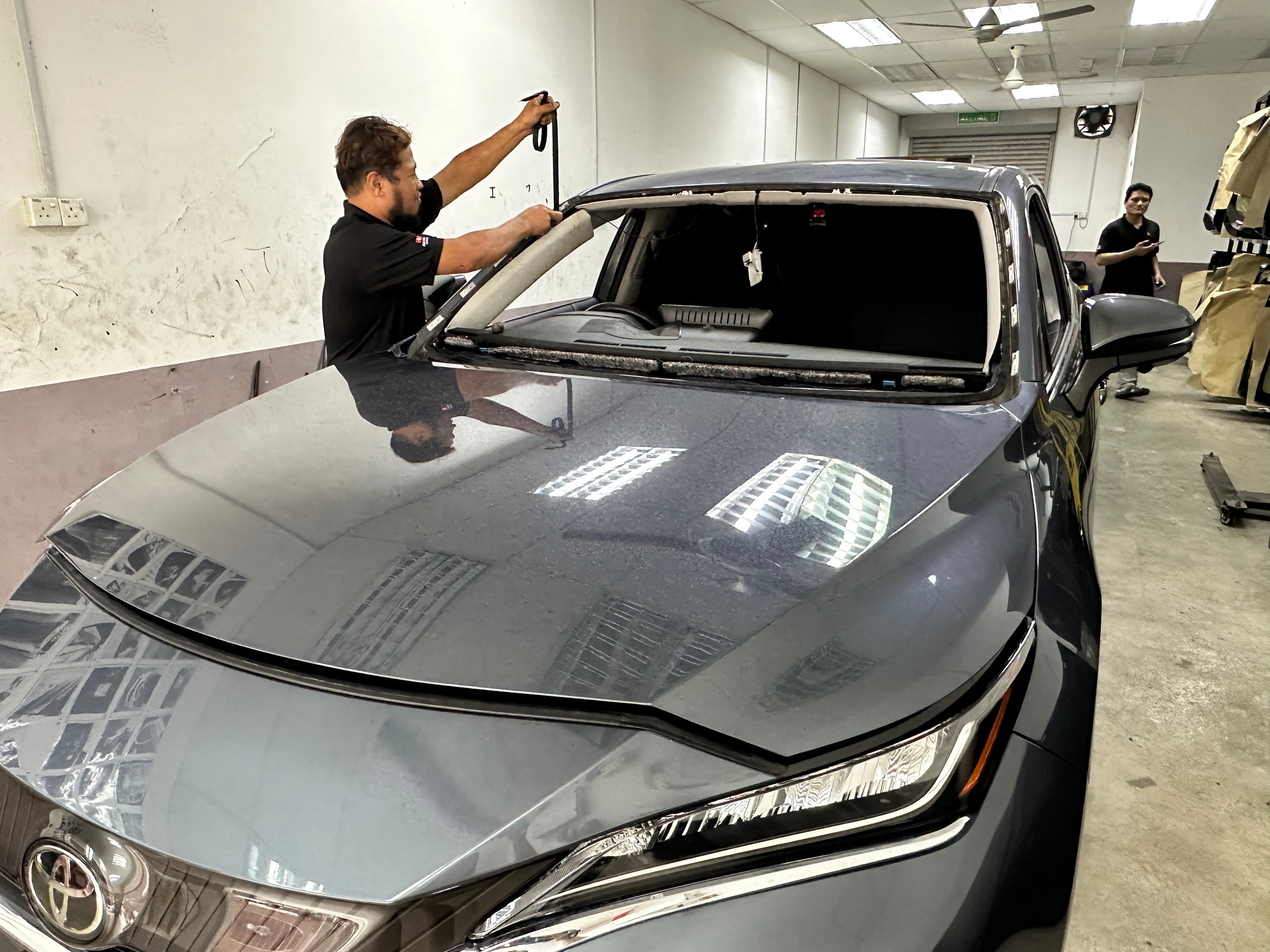 Real windscreen work on a Toyota vehicle at SIFU CERMIN Senawang HQ